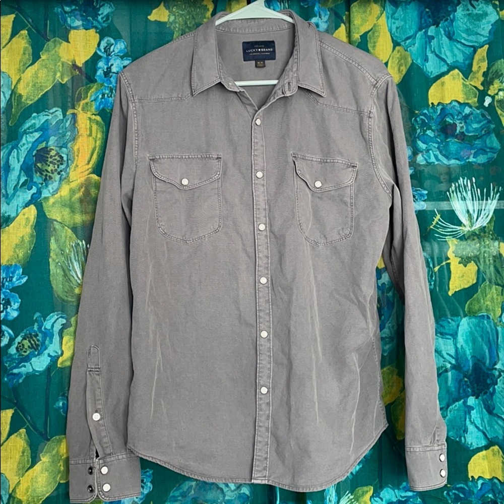 Grey long sleeve button down shirt.
